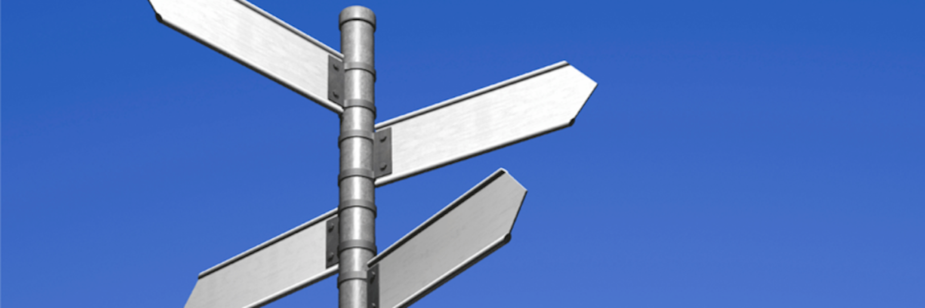 A signpost against a blue sky
