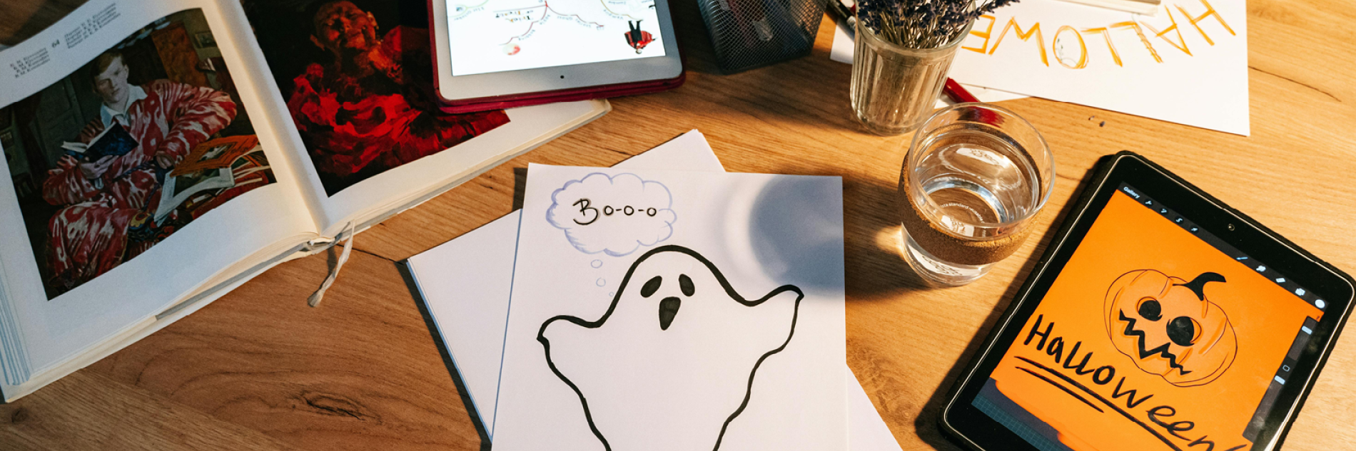 A table with drawings of a ghost and a pumpkin