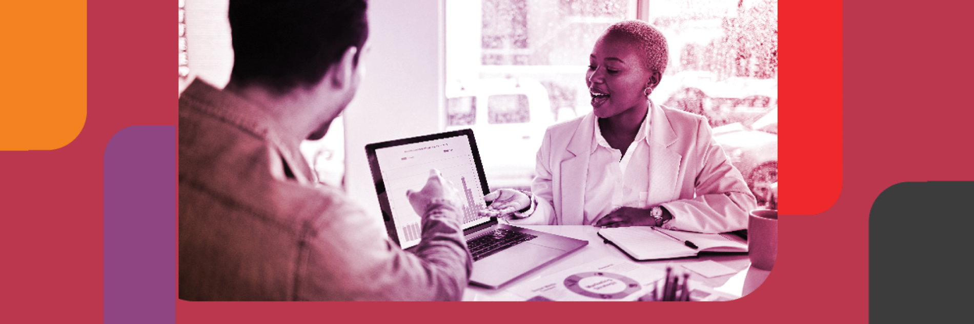 Two people discussion and pointing at a laptop